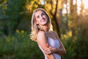 Blonde high school senior photo outdoors with beautiful lighting
